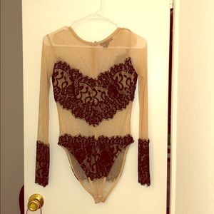 Black lace on cream sheer long sleeve body suit